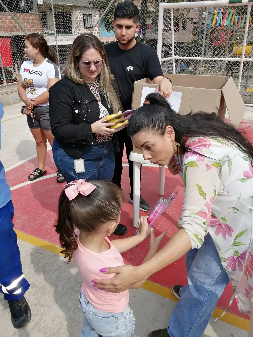 Children receiving gifts at the Hepacom Foundation's Christmas event