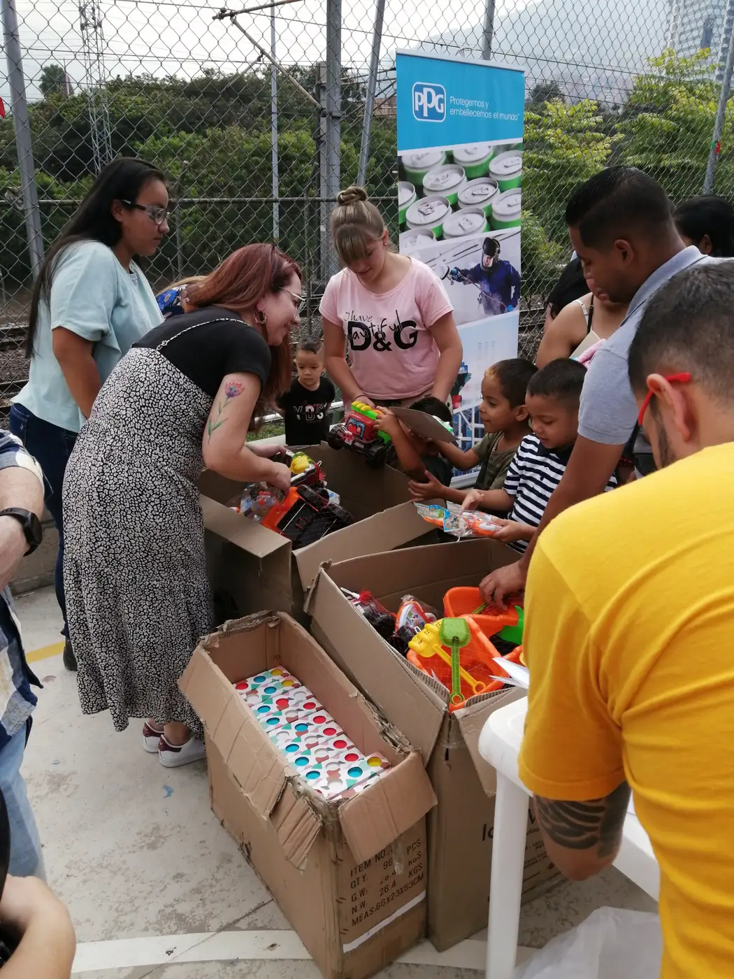 Children receiving gifts at the Hepacom Foundation's Christmas event