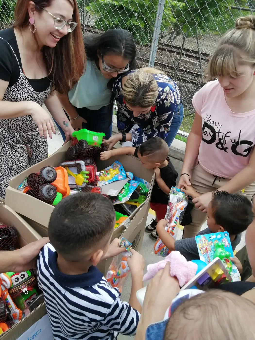 Children receiving gifts at the Hepacom Foundation's Christmas event