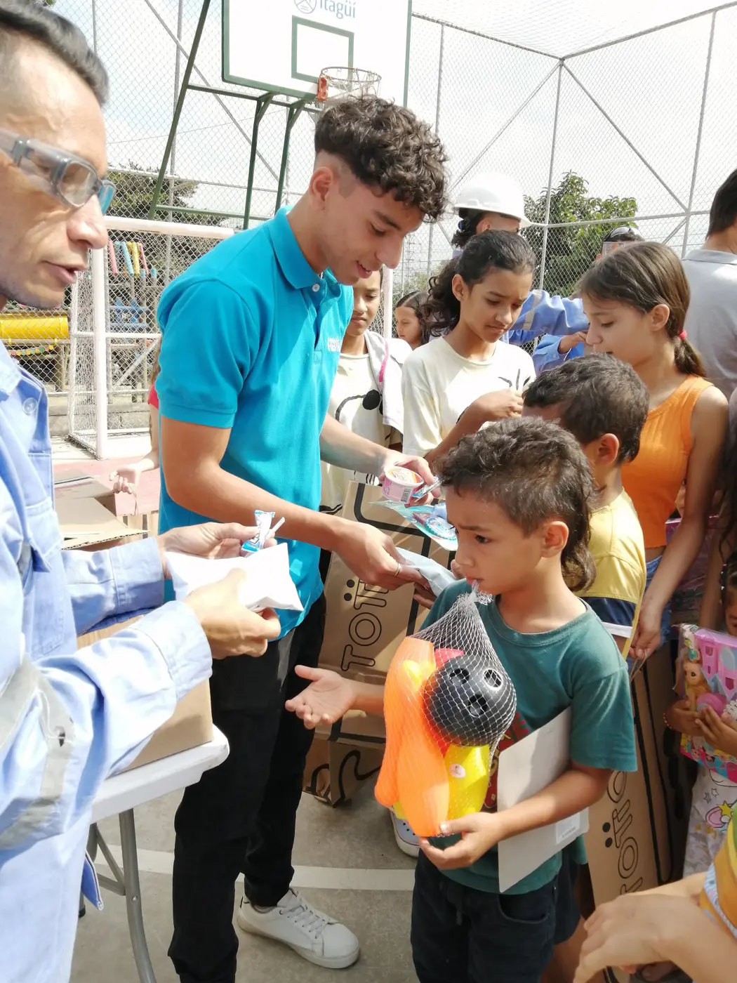 Children receiving gifts at the Hepacom Foundation's Christmas event