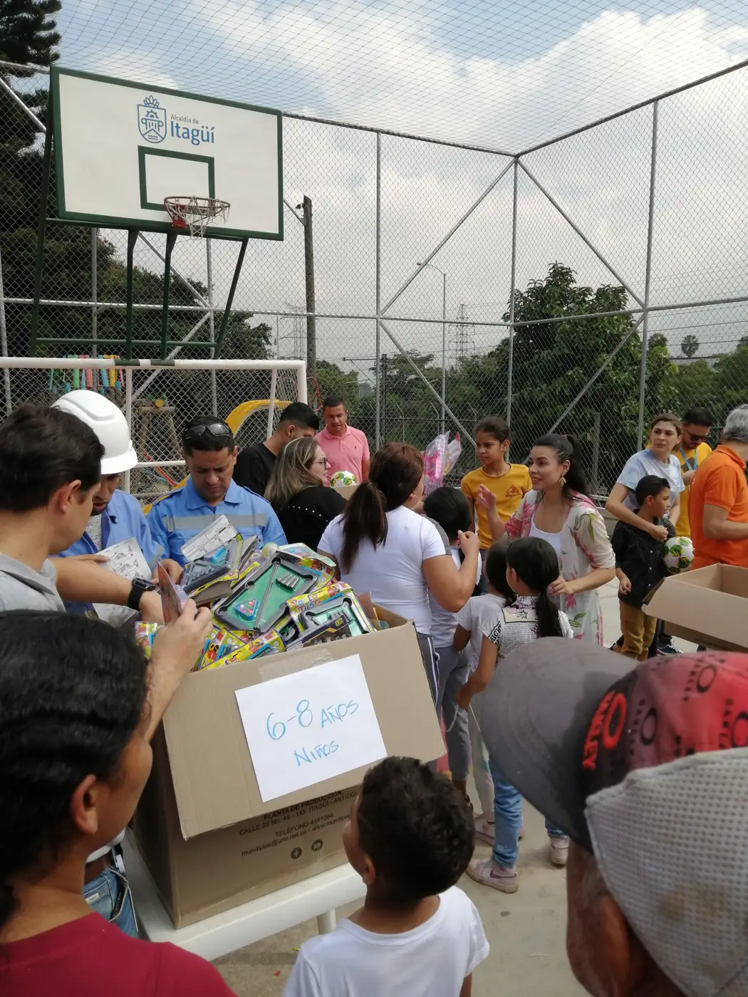 Children receiving gifts at the Hepacom Foundation's Christmas event
