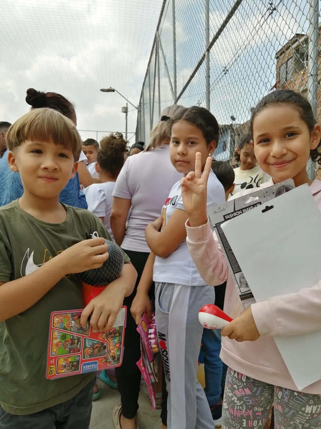 Children receiving gifts at the Hepacom Foundation's Christmas event