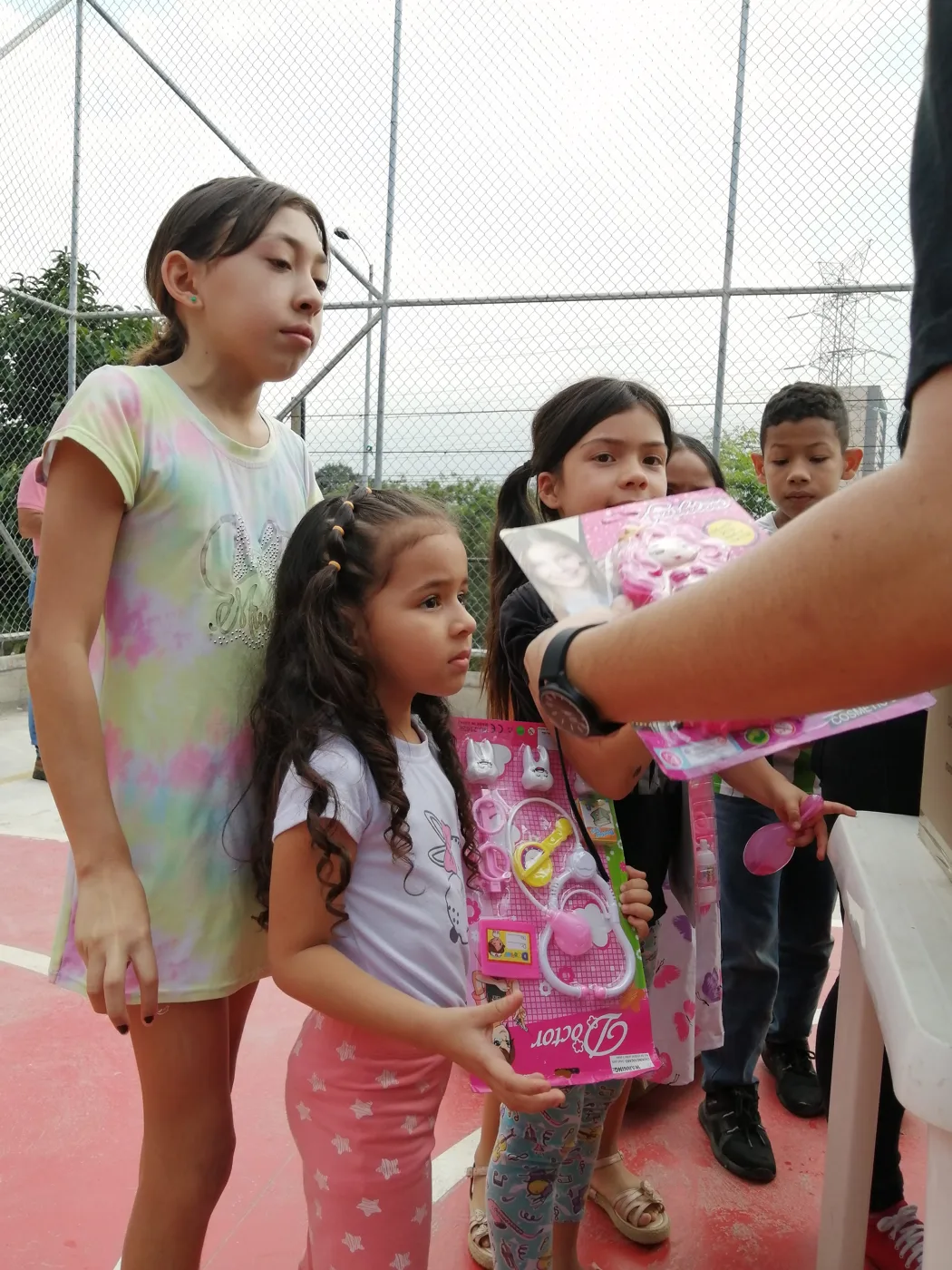 Children receiving gifts at the Hepacom Foundation's Christmas event