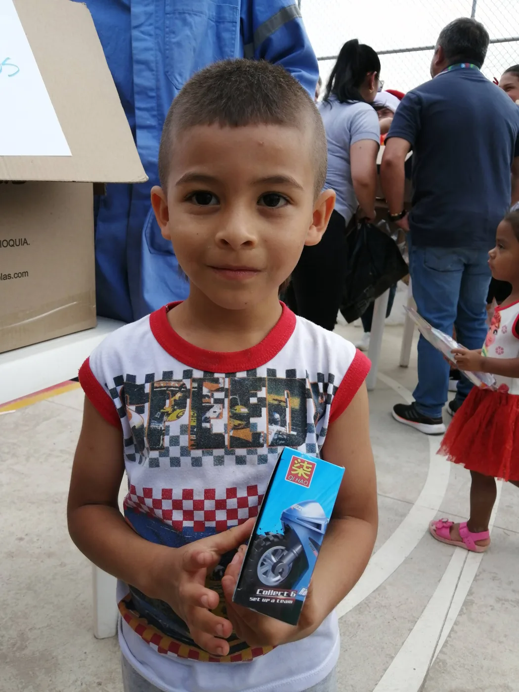 Children receiving gifts at the Hepacom Foundation's Christmas event