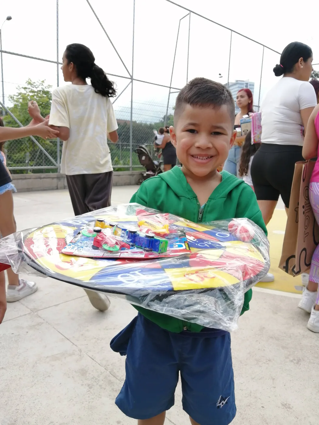 Children receiving gifts at the Hepacom Foundation's Christmas event