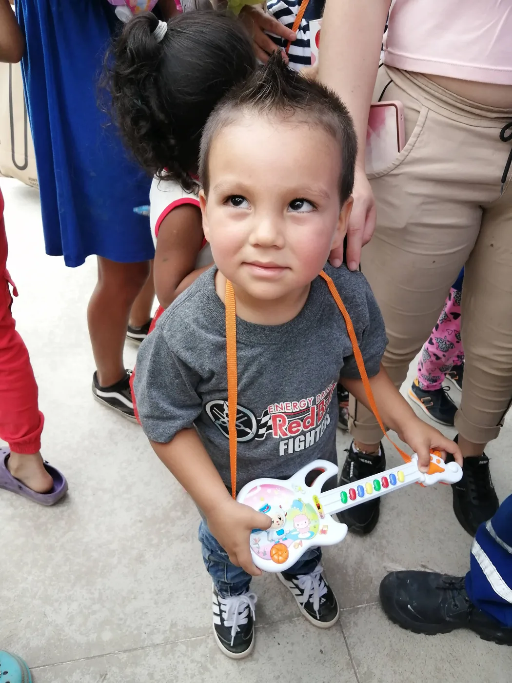 Children receiving gifts at the Hepacom Foundation's Christmas event
