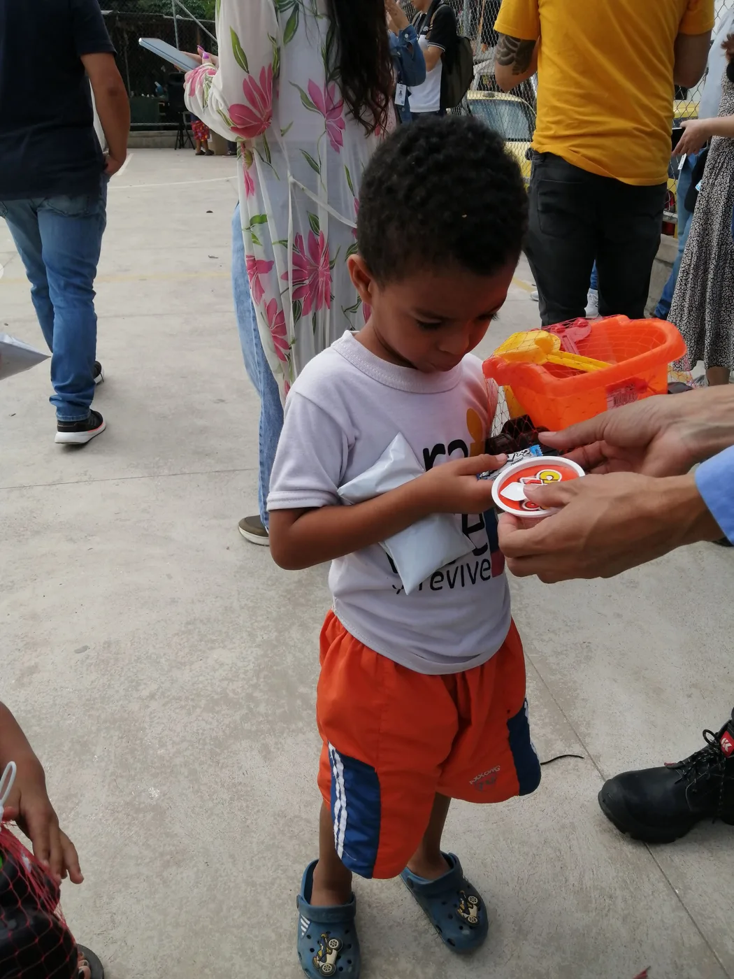 Children receiving gifts at the Hepacom Foundation's Christmas event