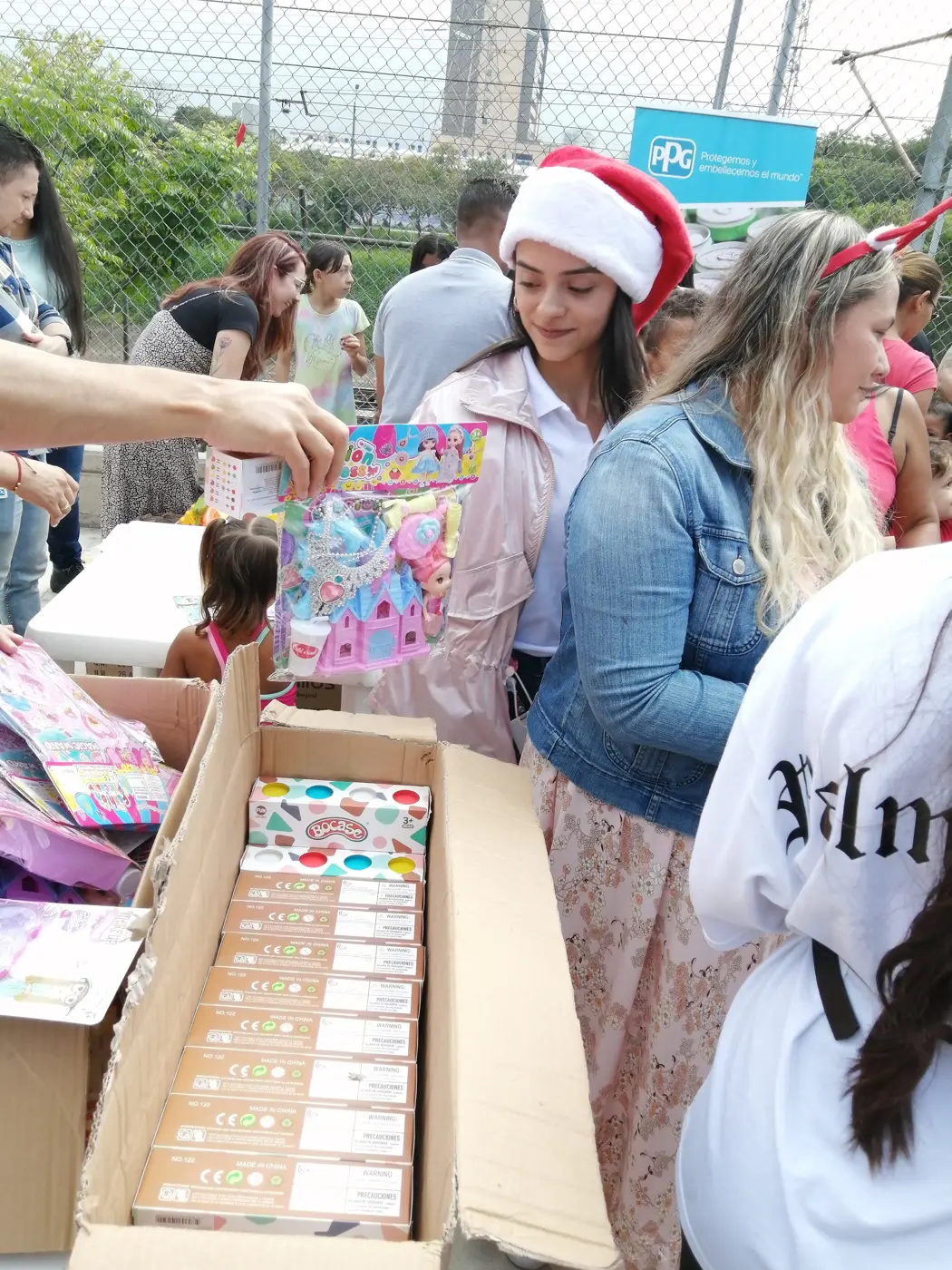 Children receiving gifts at the Hepacom Foundation's Christmas event